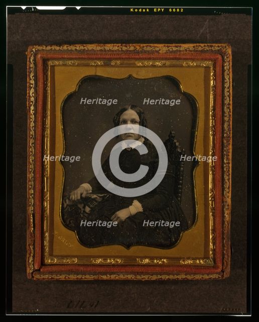 Unidentified woman, three-quarters length portrait, seated in chair with right arm..., ca. 1855. Creator: Francis Grice.