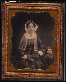 Unidentified woman, three-quarters length portrait, seated with left arm resting..., ca. 1855. Creator: Francis Grice