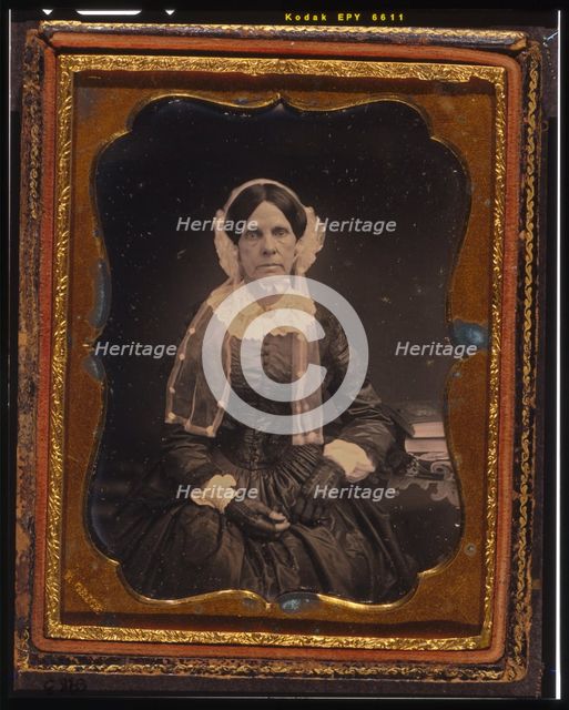 Unidentified woman, three-quarters length portrait, seated with left arm resting..., ca. 1855. Creator: Francis Grice.