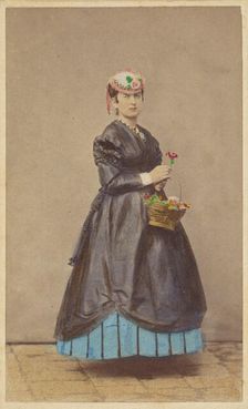 Unidentified woman wearing a flowered hat, holding single flower in one hand, basket of...1862-1865. Creator: Carlo Ponti