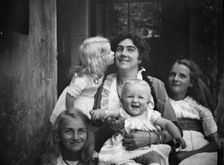 Unidentified woman with four children, portrait photograph, between 1911 and 1942. Creator: Arnold Genthe