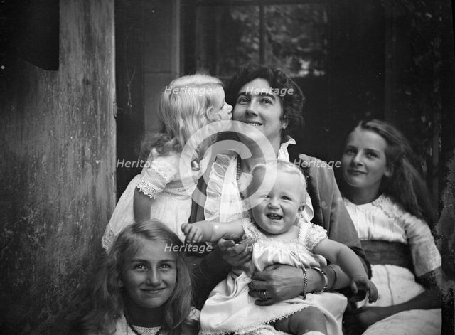 Unidentified woman with four children, portrait photograph, between 1911 and 1942. Creator: Arnold Genthe.