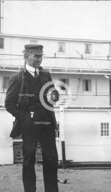 Uniformed man smoking a cigar, between c1900 and 1916. Creator: Unknown.