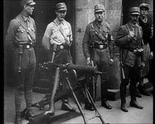 Uniformed Nazis Standing Next to a Machine Gun, 1933. Creator: British Pathe Ltd