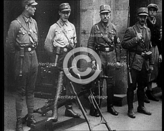 Uniformed Nazis Standing Next to a Machine Gun, 1933. Creator: British Pathe Ltd.