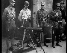 Uniformed Nazis Standing Next to a Machine Gun, 1933. Creator: British Pathe Ltd