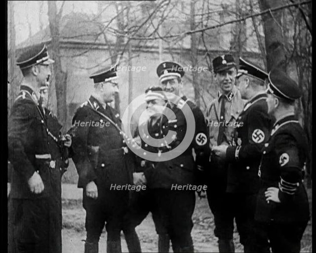 Uniformed Nazis Talking to Each Other, 1933. Creator: British Pathe Ltd.