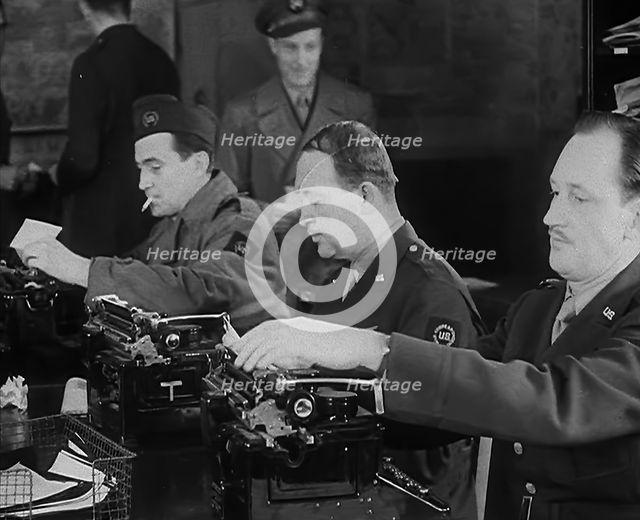 Uniformed Journalists Working, 1943. Creator: British Pathe Ltd.