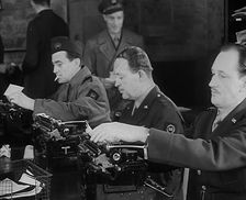 Uniformed Journalists Working, 1943. Creator: British Pathe Ltd