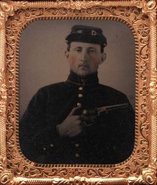 Union Soldier with Colt Revolver, in Studio, 1861-65. Creator: Unknown