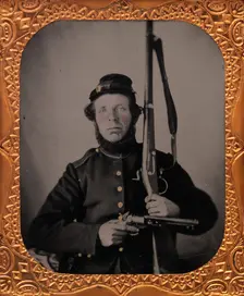 Union Private with Musket and Pistol, 1861-65. Creator: Unknown