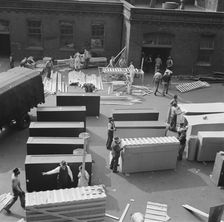 United States government workers and carpenters making crates for steel... Washington, D.C., 1942. Creator: Gordon Parks