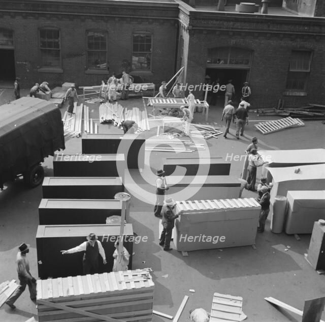 United States government workers and carpenters making crates for steel... Washington, D.C., 1942. Creator: Gordon Parks.