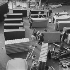 United States government workers and carpenters making crates for steel..., Washington, D.C., 1942. Creator: Gordon Parks