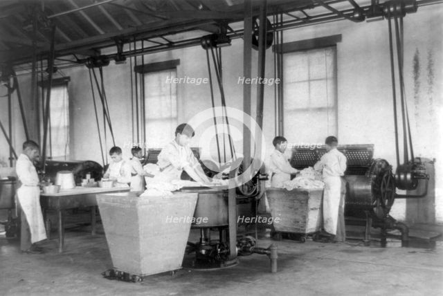 United States Indian School, Carlisle, Pennsylvania, six boys doing laundry, 1901. Creator: Frances Benjamin Johnston.