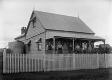 Unknown family portrait and family with monkey on verandah, c1900s. Creator: Robert Augustus Henry L'Estrange