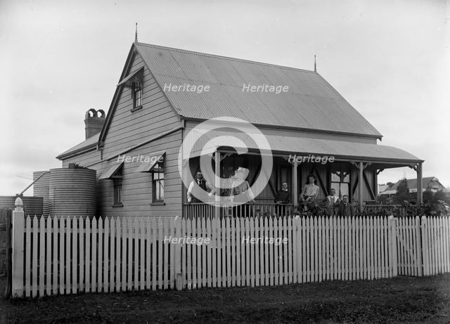 Unknown family portrait and family with monkey on verandah, c1900s. Creator: Robert Augustus Henry L'Estrange.