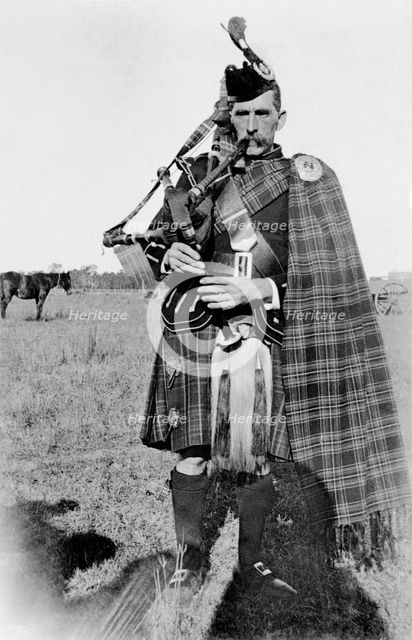 Unknown man in full Scottish kilt with bagpipes, c1900s. Creator: Robert Augustus Henry L'Estrange.