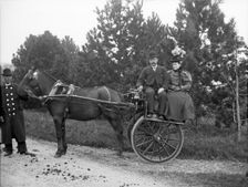 Unknown people in horse drawn cart and coachman; possibly Chester, England (Bache Hall), 1895. Creator: Robert Augustus Henry L'Estrange