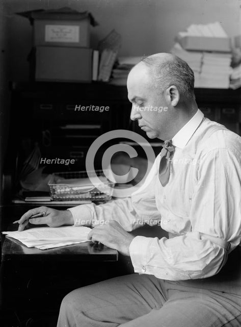Unknown politician at desk, 1912. Creator: Harris & Ewing.
