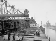 Unloading ore at Conneaut, Ohio, Brown conveying hoists, between 1900 and 1906. Creator: Unknown