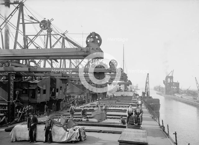 Unloading ore at Conneaut, Ohio, Brown conveying hoists, between 1900 and 1906. Creator: Unknown.