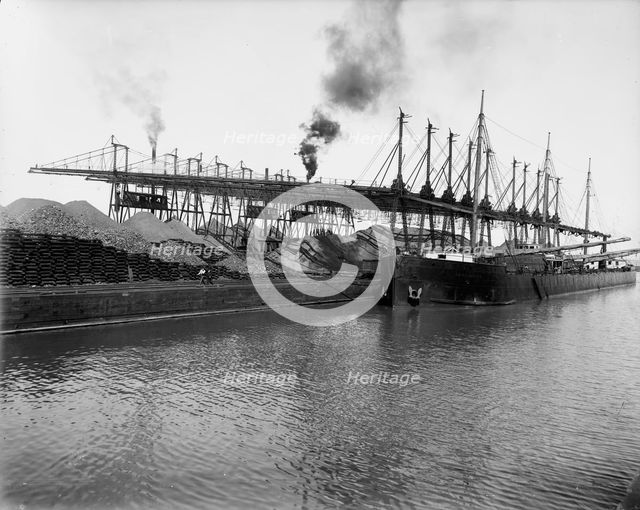 Unloading ore at L.S. & M.S. [Lake Shore & Michigan Southern] Ry. Co.'s docks, Ashtabula, Ohio,c1900 Creator: Unknown.