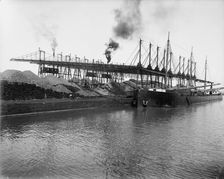 Unloading ore at L.S. & M.S. [Lake Shore & Michigan Southern] Ry. Co.'s docks, Ashtabula, Ohio,c1900 Creator: Unknown