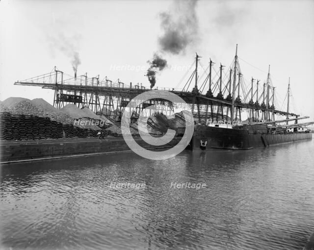 Unloading ore at L.S. & M.S. [Lake Shore & Michigan Southern] Ry. Co.'s docks, Ashtabula, Ohio,c1900 Creator: Unknown.
