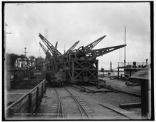 Unloading ore from whaleback, Buffalo, c1900. Creator: Unknown