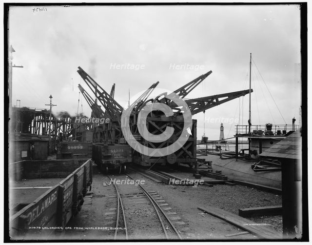 Unloading ore from whaleback, Buffalo, c1900. Creator: Unknown.