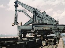 Unloading a lake freighter at the Pennsylvania Railroad iron ore docks...Cleveland, Ohio, 1943. Creator: Jack Delano