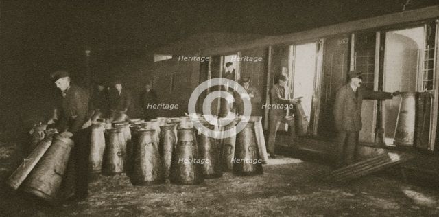 Unloading a milk train, London, 20th century.  Creator: Unknown.