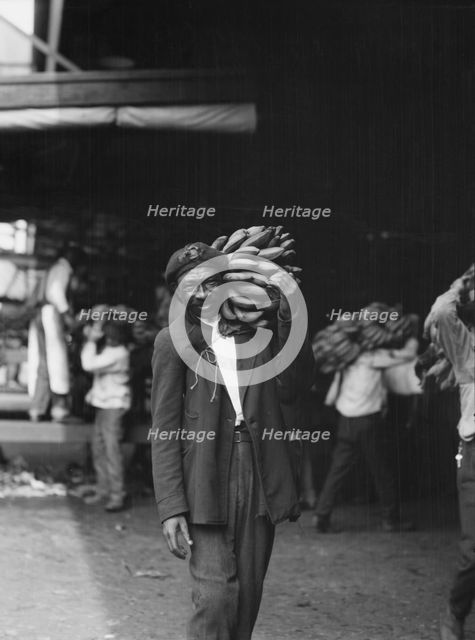 Unloading bananas, New Orleans, between 1920 and 1926. Creator: Arnold Genthe.