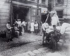Unloading food, the House of Scientists, Petrograd, Russia, c1920-c1924(?)