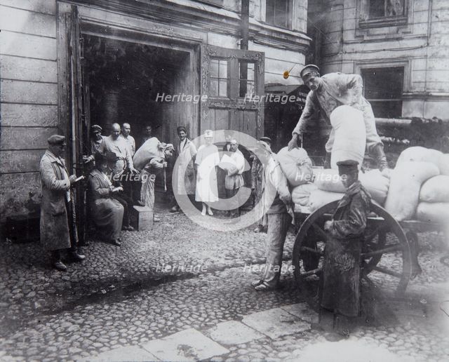 Unloading food, the House of Scientists, Petrograd, Russia, c1920-c1924(?). Artist: Unknown