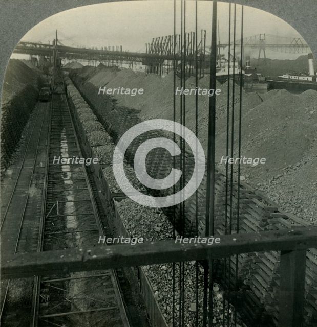 'Unloading Iron ore at Port of Cleveland, Ohio, the Heaviest Handler of Ore in the World', c1930s. Creator: Unknown.