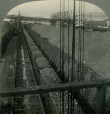 Unloading Iron ore at Port of Cleveland, Ohio, the Heaviest Handler of Ore in the World c1930s. Creator: Unknown