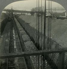 Unloading Iron ore at Port of Cleveland, Ohio, the Heaviest Handler of Ore in the World c1930s. Creator: Unknown