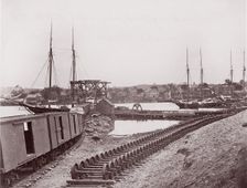 Unloading Supplies for U.S. Military Railroad opposite Richmond, Virginia, ca. 1865. Creator: Unknown
