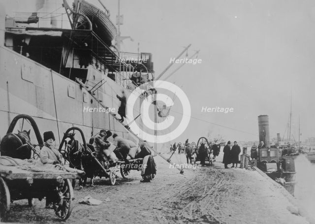 Unloading SEATTLE, Archangel, between c1915 and c1920. Creator: Bain News Service.