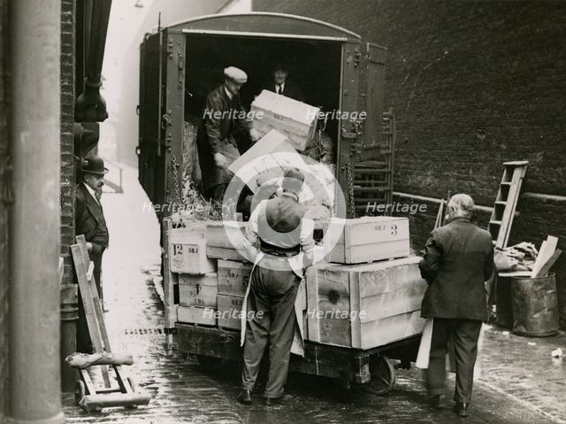 Unloading the exhibits for the 'International Exhibition of Chinese Art', 1935. Creator: Topical Press Agency.