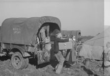 Unloading the household goods of a family who is being moved into..., Forrest City, Arkansas, 1937. Creator: Walker Evans