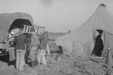 Unloading the household goods of a family who is being..., Forrest City, Arkansas, 1937. Creator: Walker Evans
