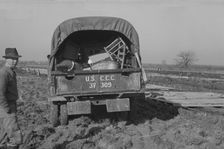 Unloading the household goods of a family who is being..., Forrest City, Arkansas, 1937. Creator: Walker Evans