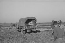 Unloading the household goods of a family who is being..., Forrest City, Arkansas, 1937. Creator: Walker Evans