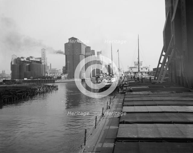 Unloading wheat, Buffalo, N.Y., c.between 1910 and 1920. Creator: Unknown.