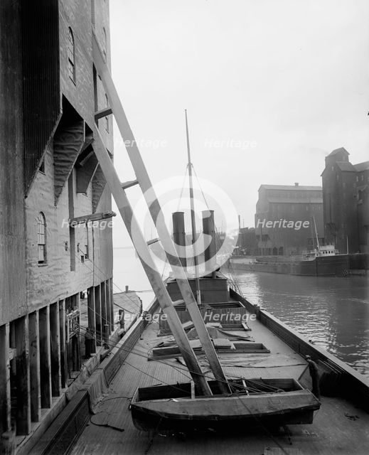 Unloading wheat into elevators, Buffalo, c1900. Creator: Unknown.