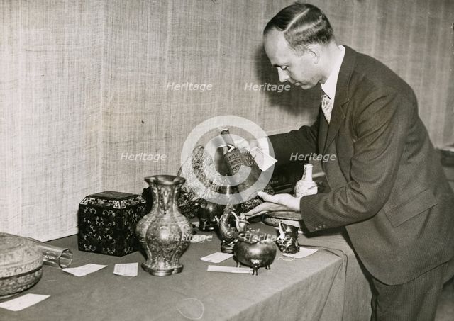 Unpacking and examining the exhibits for the 'International Exhibition of Chinese Art', 1935. Creator: Sport and General Press Agency.
