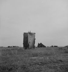 Unsanitary privy in potato pickers camp near Shafter, California, 1937. Creator: Dorothea Lange